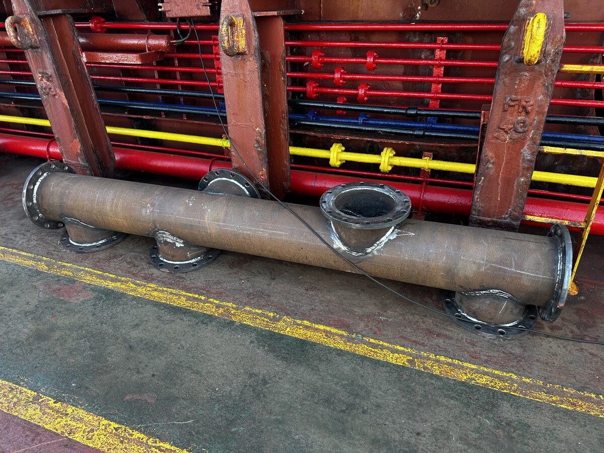 Cooling water manifold fabricated from measurements and installed