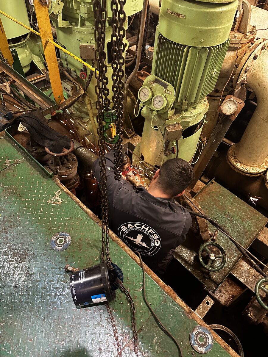 FSQ technician working in the engine room of a vessel